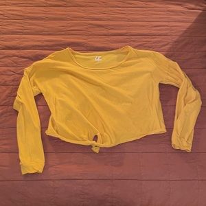 Yellow long sleeve crop top with knot at bottom